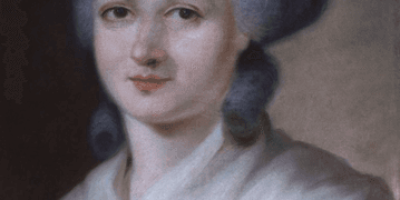 Beyaz saçlı ve beyaz tenli, üzerinde beyaz bir şal olan Olympe De Gouges’ portresi.